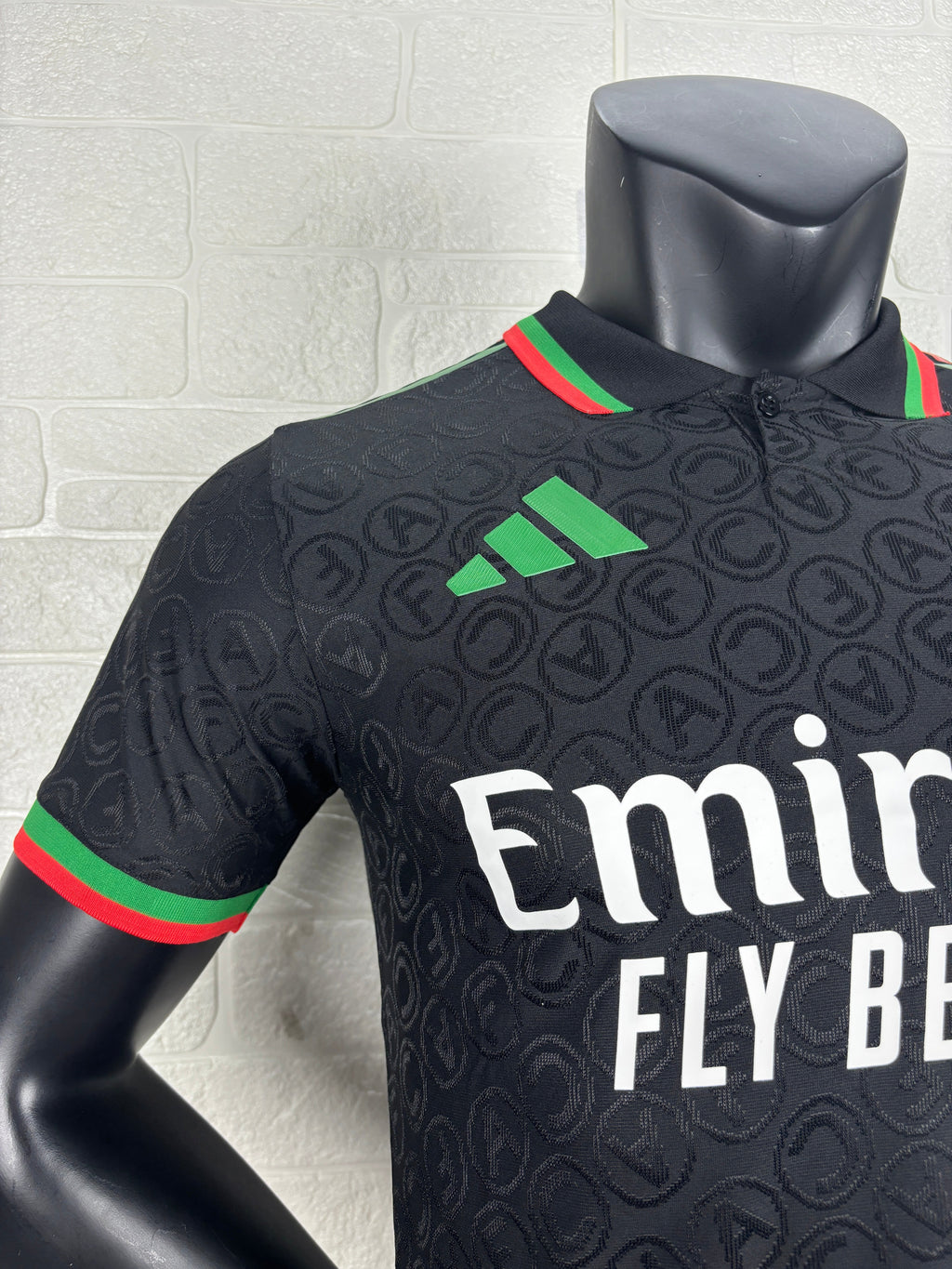 2025/26 Arsenal Special Edition Black Player Version Jersey - Black Body All-Over Tonal Cannon Circular Emboss Pattern Black Polo Collar Green Red Double Stripe Trim - Green Three Stripes - Red Arsenal Cannon Crest - Emirates Fly Better