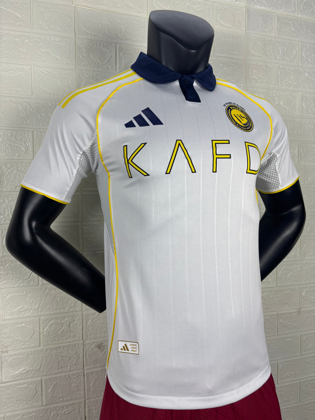 2025/26 Al-Nassr Away Player Version Jersey - White Body - Dark Navy Blue Polo Collar - Gold Yellow Side Seam Piping - KAFD Gold Yellow Sponsor