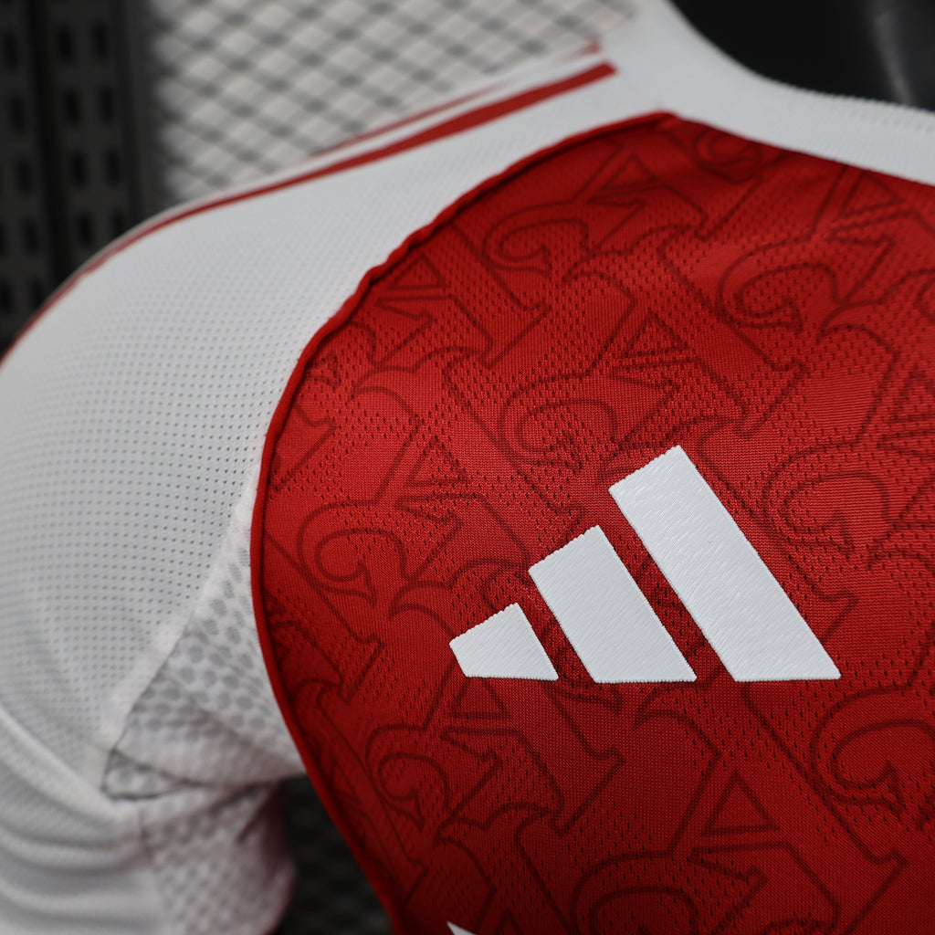 2025/26 Arsenal Home Player Version Jersey - Red Body White Sleeves All-Over Subtle Graphic Texture - White Three Stripes - Arsenal Cannon Crest - Emirates Fly Better Principal Sponsor - Men's