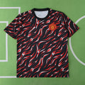 Manchester United Training Shirt Fan Version 2025/26 – Black Red Flame Print Pre-Match Top
