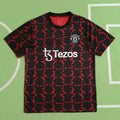 Manchester United Training Shirt Fan Version 2024/25 – Black Red Diamond Pattern Tezos Pre-Match Top