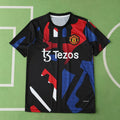 Manchester United Training Shirt Fan Version 2024/25 – Black Red Blue Geometric Tezos Pre-Match Top