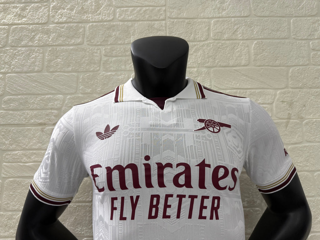 2025/26 Arsenal Third Player Version Jersey - White Body All-Over Subtle Tonal Graphic Texture Deep Maroon Polo Collar Gold Cream Stripe Trim Deep Maroon Sleeve Cuff Trim - Originals Trefoil - Arsenal Cannon Crest - Emirates Fly Better